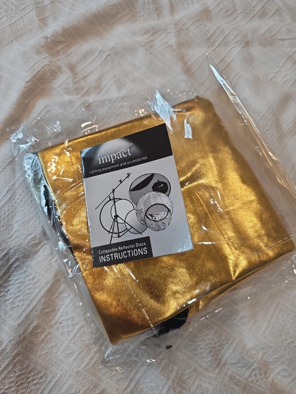 A folding light reflector for Impact brand photography